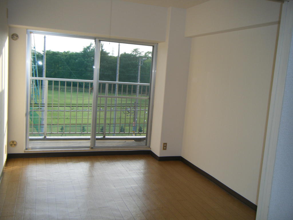 Living and room. Bright sunlight pours balcony side Western-style