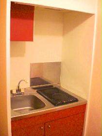 Kitchen. Cooking fun red with cute kitchen space!