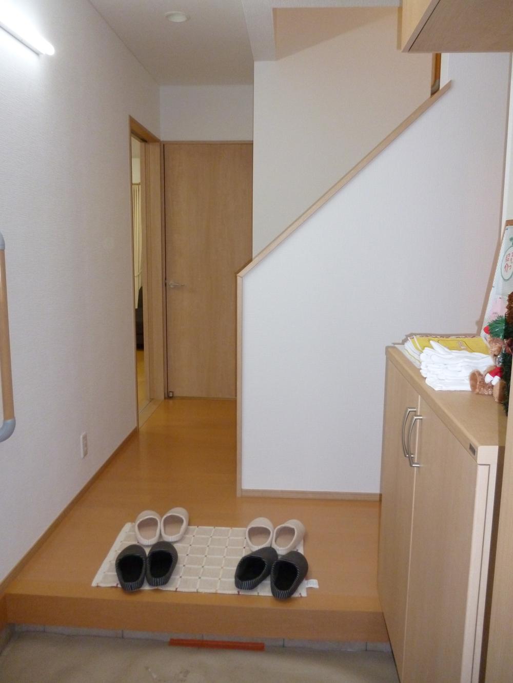 Entrance. It is the entrance with a large shoebox. 