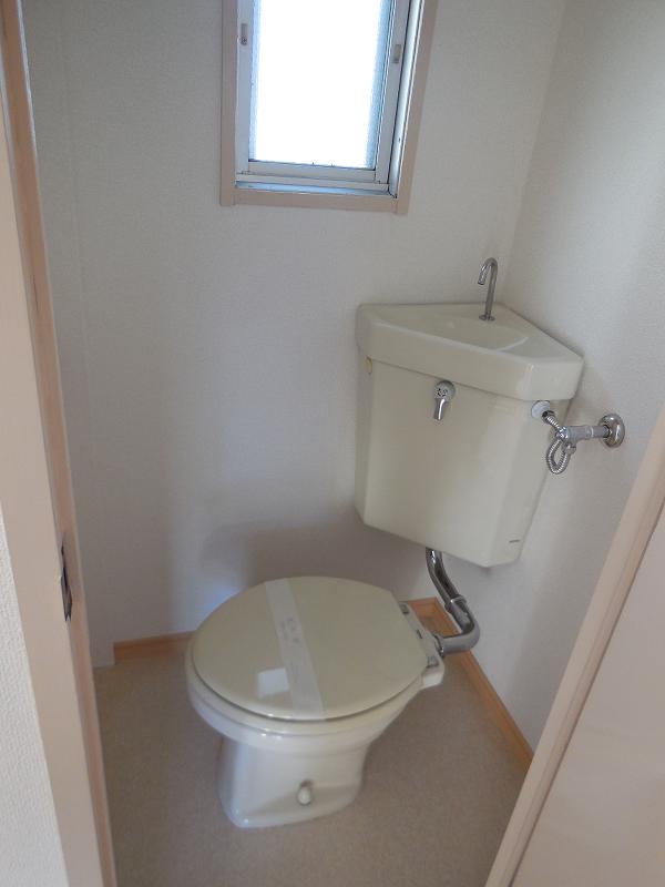 Toilet. It is with a window.