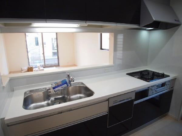 Kitchen. It overlooks the living room, Kitchen attained the family and communication. You clean up is Easy because even with dish washing and drying machine.