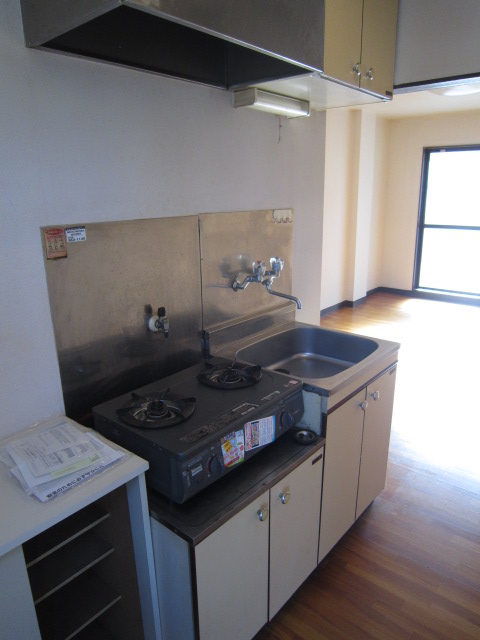 Kitchen. There service goods stove