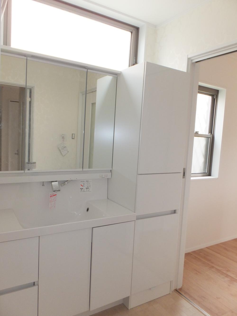 Wash basin, toilet. Abundance of storage boasts. 