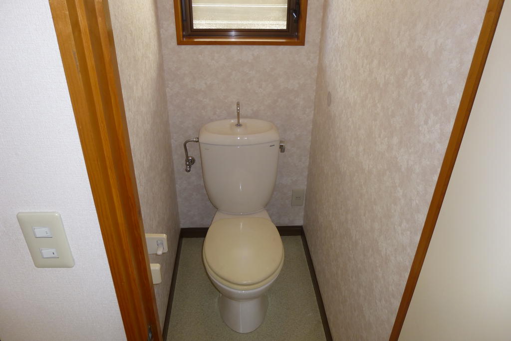 Toilet. There is a window in the toilet