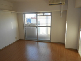 Living and room. It is a corner room. 