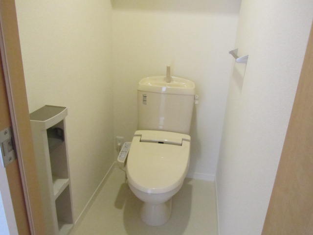 Bath. With warm water washing toilet seat