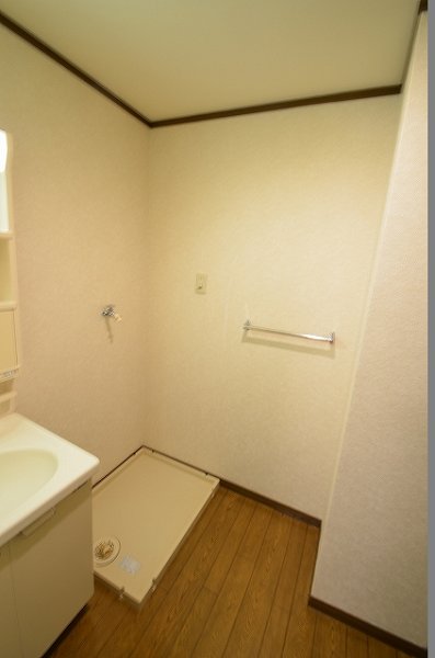 Washroom. Washing machine in the room