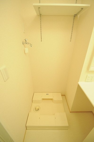 Washroom. Washing machine in the room