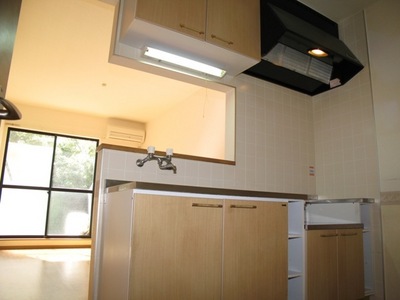 Kitchen. 2 lot gas stoves corresponding woodgrain kitchen set