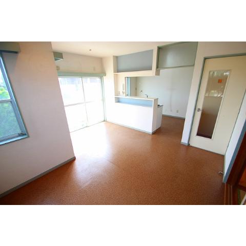 Living and room. It is another room photo of the same building. 