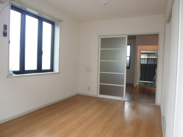 Living and room. It is a photograph of another room