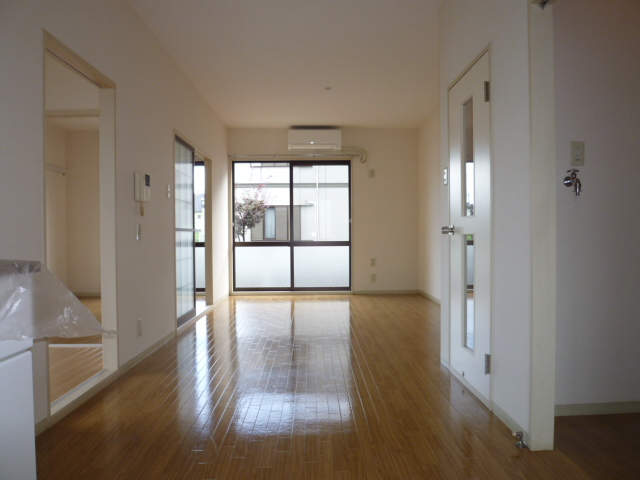 Living and room. It is a photograph of another room of the same properties