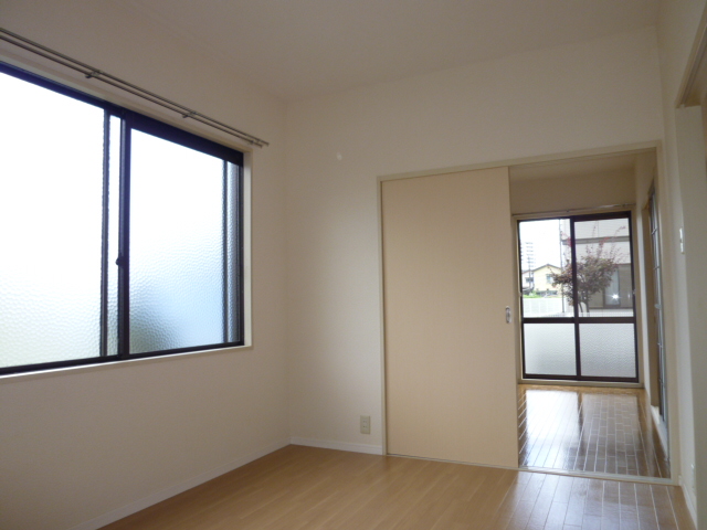 Other room space. It is a photograph of another room of the same properties