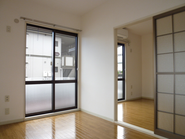 Other room space. It is a photograph of another room of the same properties