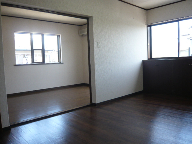Living and room. It is a photograph of another room in the same building. 