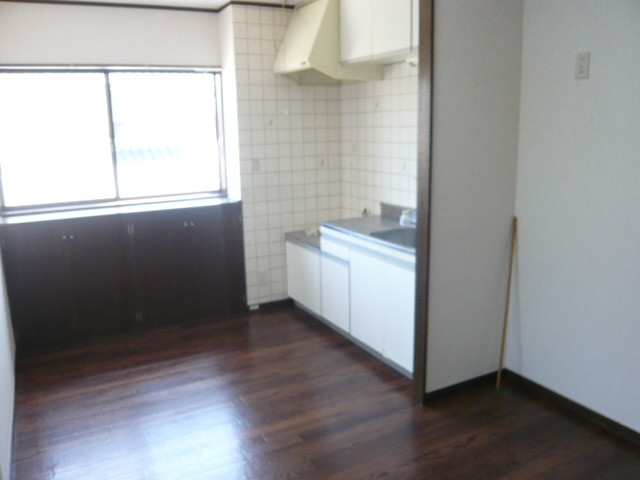 Living and room. It is a photograph of another room in the same building. 