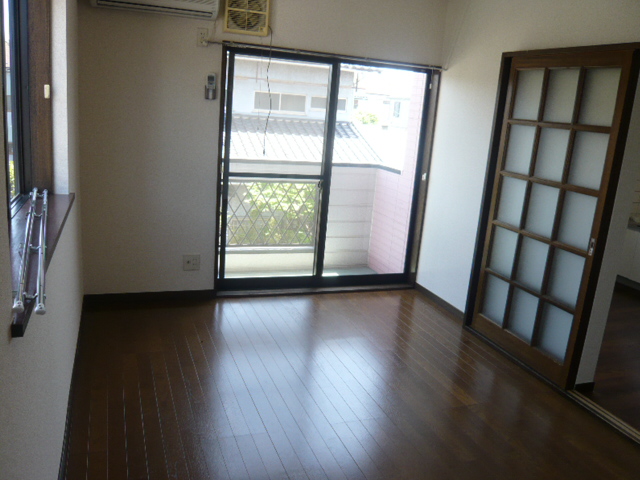 Living and room. It is a photograph of another room in the same building. 