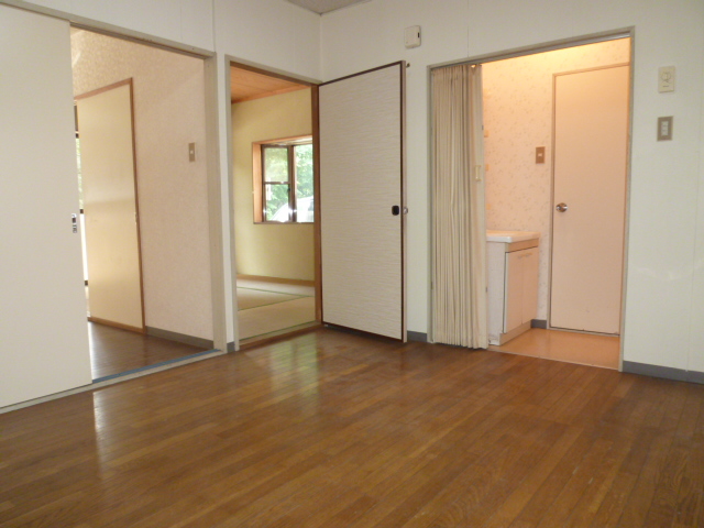 Living and room. It is a photograph of another room