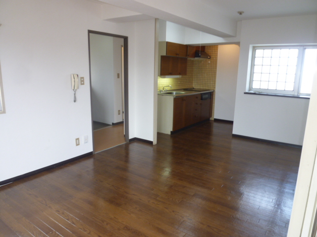 Living and room. It is a photograph of another room