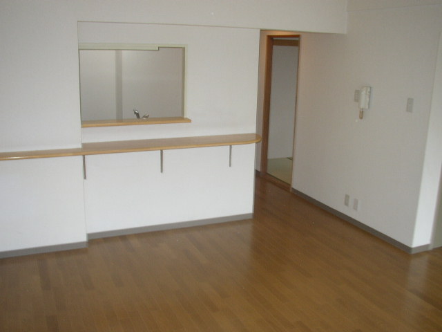 Living and room. It is a photograph of another room