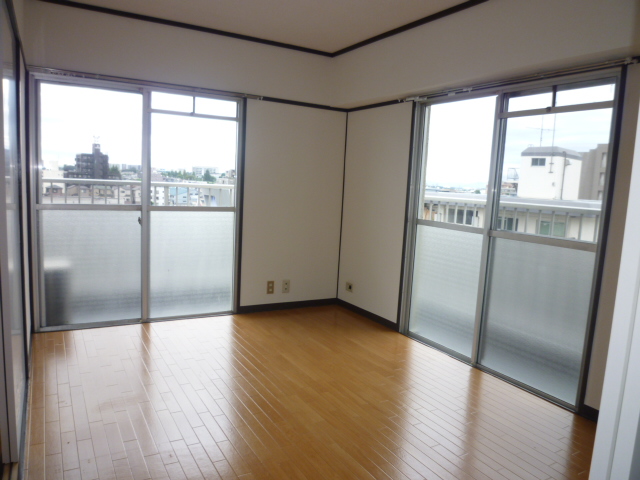 Living and room. It is a photograph of another room