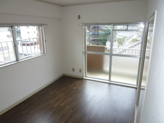 Living and room. It is a photograph of another room