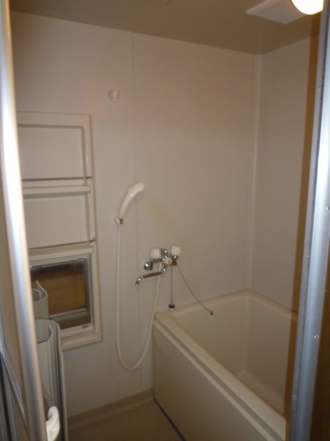 Bath. It is a bathroom with a mirror.