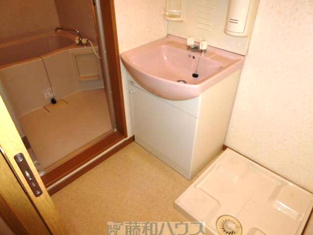 Washroom. Washing machine in the room