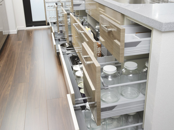 Kitchen.  [Sliding storage] Storage of system kitchens, It can be effectively utilized in the prone cabinet in a dead space, It has adopted a sliding storage.