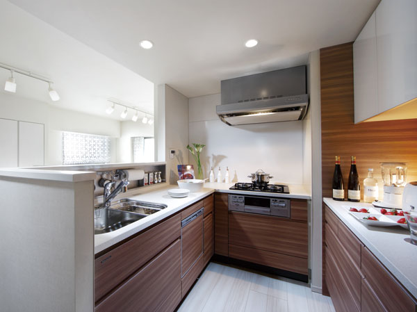 Kitchen.  [Ellesmere kitchen] Actually incorporating the line of sight of those who stand in the kitchen, Not only the ease of use with an emphasis also communication and design, It is a kitchen for families.