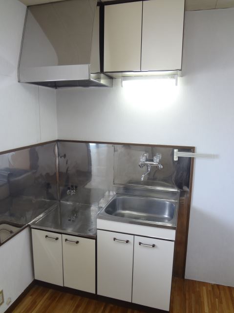 Kitchen. Two-burner gas stove is put kitchen. 