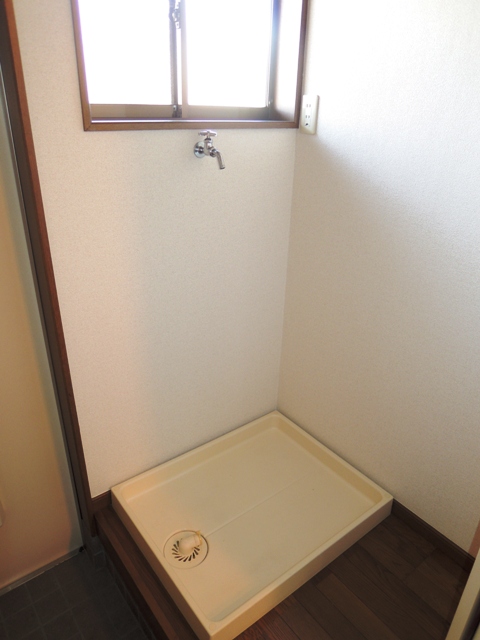 Other room space. Washing machine in the room