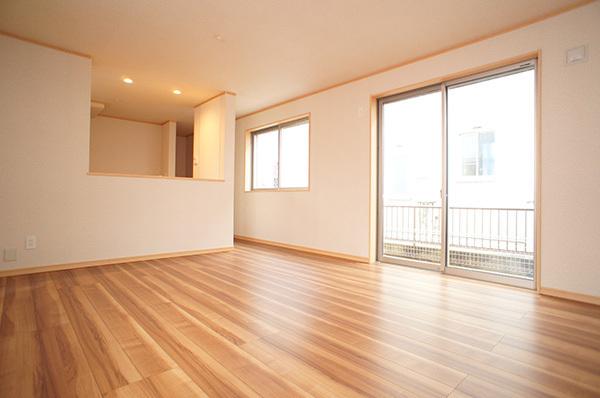 Living. Plenty of sunshine from large windows shine in