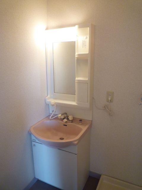 Washroom. Washing machine storage in the dressing room. Tub easy to use of water washing machine.