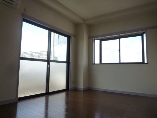 Living and room. One is there is a window to the two sides is the bay window.