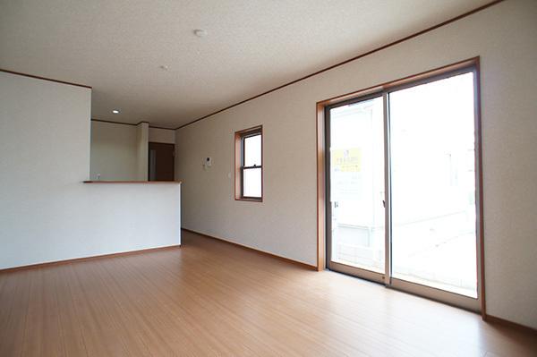 Living. Plenty of sunshine from large windows shine in