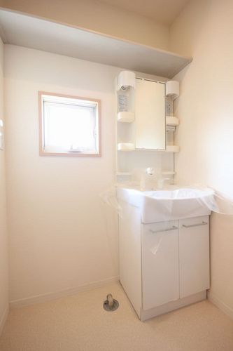 Washroom. Convenient Vanity. You can also bright and ventilation with a small window.