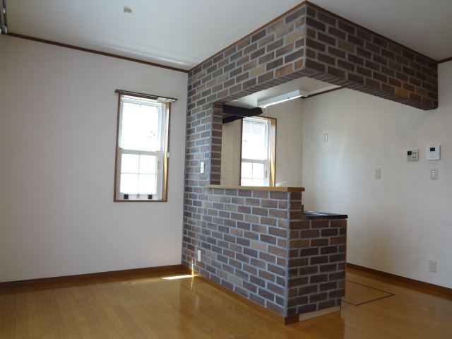 Living and room. Stylish brick stuck in the kitchen