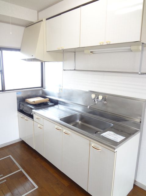 Kitchen. Two-burner stove is in the kitchen.