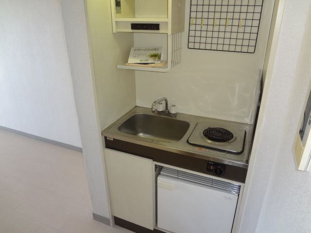 Kitchen. It is a kitchen with a mini-fridge