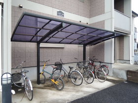 Building appearance. There is a covered parking lot. 