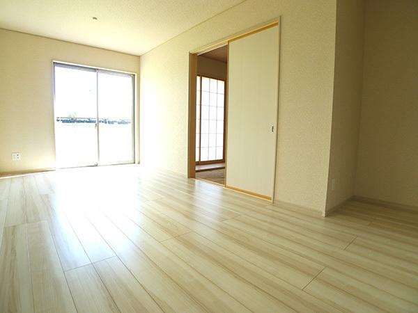 Living. Plenty of sunshine from large windows shine in