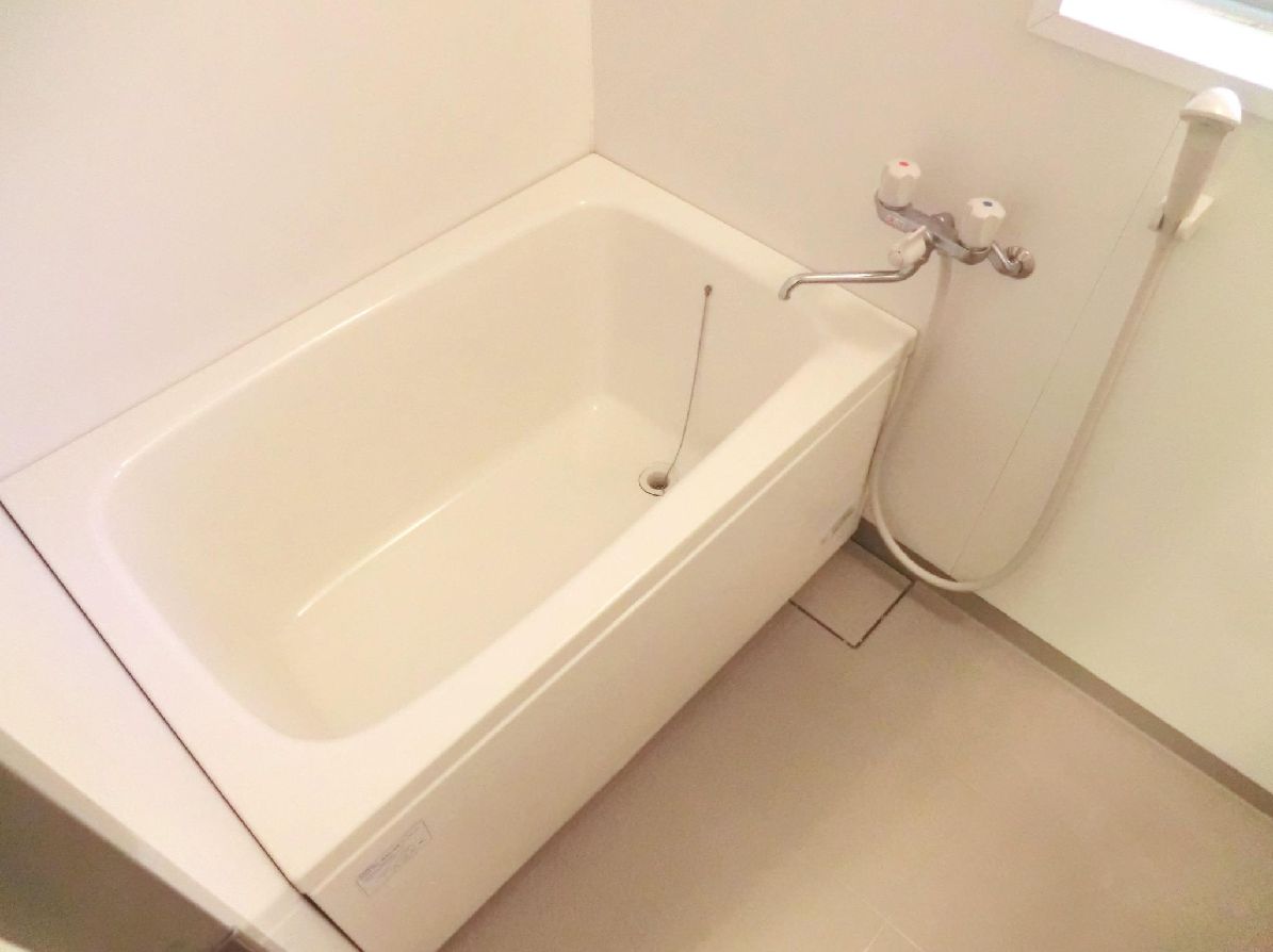 Bath. There is a small window in the bathroom