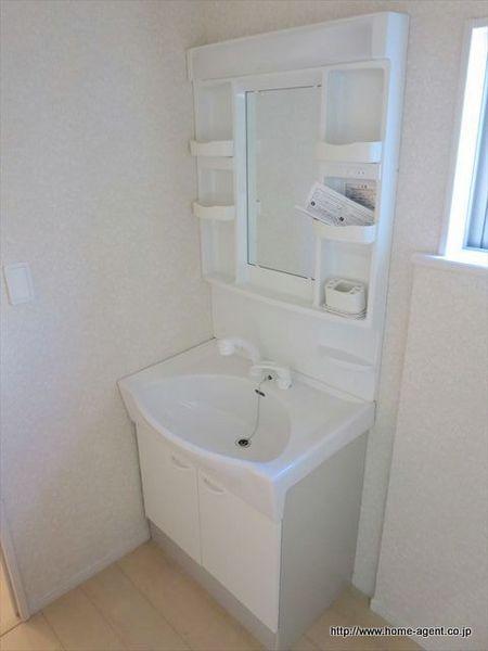 Wash basin, toilet. It puts things a lot