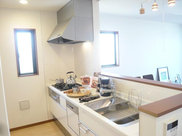 Kitchen. Dishwasher with counter kitchen of A Building. Wife is a space that can be devoted to housework in a bright feeling.