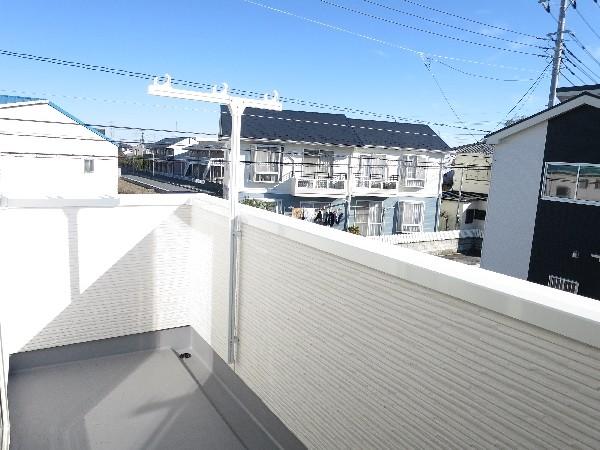 Balcony. A balcony with depth. Also Jose with confidence a lot of laundry. 