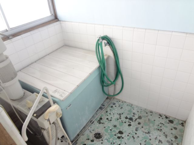 Bath. It is the balance kettle type bathroom with a window.