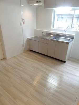 Living and room. There is a window in the kitchen