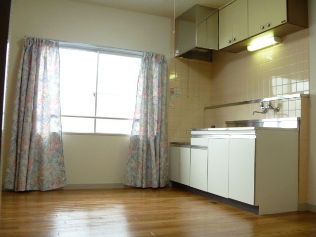 Living and room. There are also large opening in the kitchen next to. 