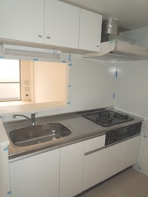 Kitchen. 3-burner stove with a kitchen where the width of the cooking spread